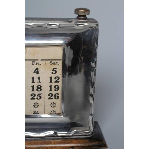 190 - A GEORGE V SILVER PERPETUAL DESK CALENDAR by W J Myatt & Co., Birmingham 1928, of oblong form, the a... 