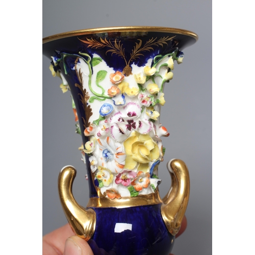31 - A PAIR OF BLOOR DERBY PORCELAIN SMALL CAMPANA URNS encrusted with flowers on a gilt highlighted coba... 