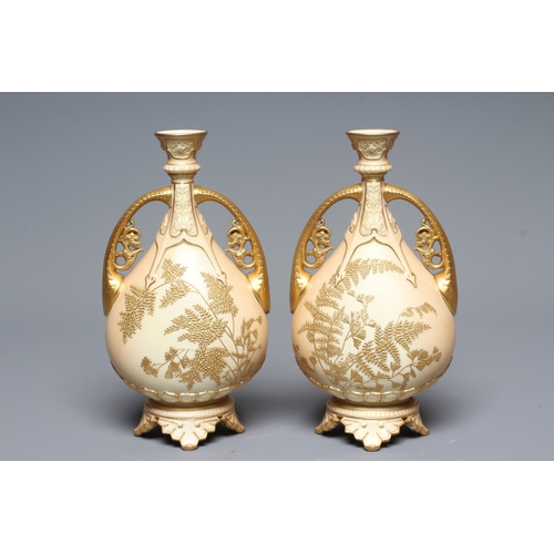 39 - A PAIR OF ROYAL WORCESTER VASES, 1892, of flattened ovoid form with buttress handles, decorated in r... 