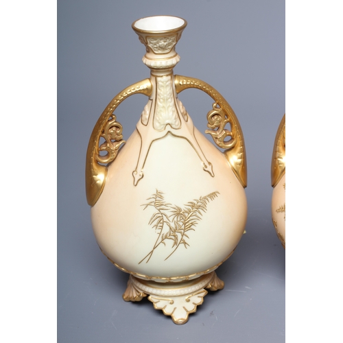 39 - A PAIR OF ROYAL WORCESTER VASES, 1892, of flattened ovoid form with buttress handles, decorated in r... 