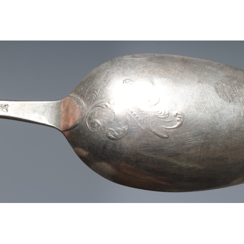 141 - A GEORGE III SILVER SHELL BACK MOTE SPOON by James Wilkes, maker's mark stamped twice only, with arr... 