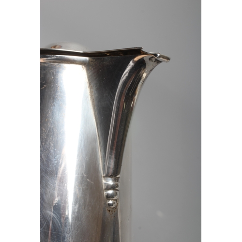 143 - AN EDWARD VII SILVER HOT WATER JUG by Martin, Hall & Co., Sheffield 1910, of plain tapering cylindri... 