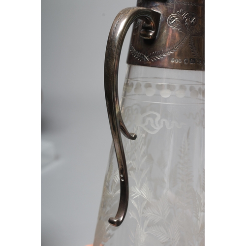 146 - A VICTORIAN SILVER MOUNTED GLASS CLARET JUG by Hukin & Heath, Birmingham 1882, the clear tapering cy... 