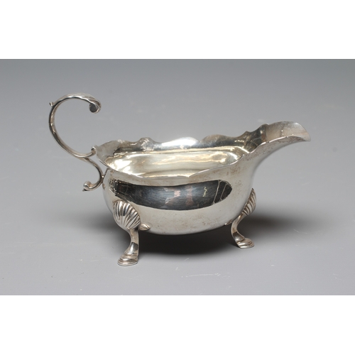 148 - A GEORGE II SILVER SAUCEBOAT by Andrew Killick, London 1751, the oval bowl with everted cut rim, aca... 