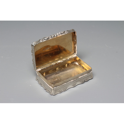 150 - AN EARLY VICTORIAN SILVER SNUFF BOX by George Unite, Birmingham 1854, of shaped oblong form with wav... 