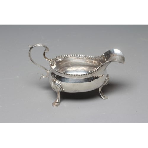 158 - AN EARLY GEORGE III SILVER SAUCEBOAT possibly by William Kersill, London 1769, the oval bowl with cr... 