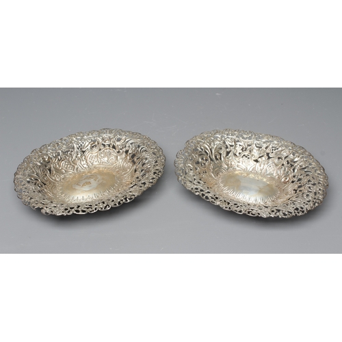 162 - A COMPOSITE PAIR OF LATE VICTORIAN SILVER BON BON DISHES by L Spiers, Birmingham 1891 & 1892, of fla... 