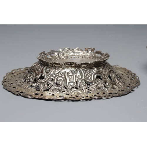 162 - A COMPOSITE PAIR OF LATE VICTORIAN SILVER BON BON DISHES by L Spiers, Birmingham 1891 & 1892, of fla... 