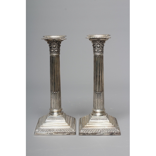 169 - A PAIR OF GEORGE V SILVER CORINTHIAN CANDLESTICKS by Fenton, Russell & Co. Ltd., Sheffield 1911, wit... 