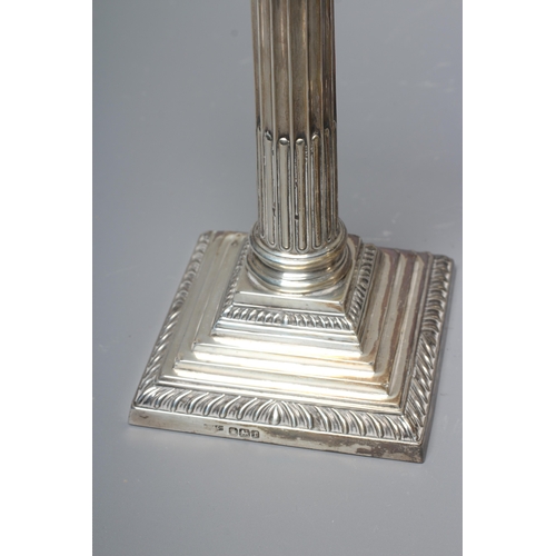 169 - A PAIR OF GEORGE V SILVER CORINTHIAN CANDLESTICKS by Fenton, Russell & Co. Ltd., Sheffield 1911, wit... 