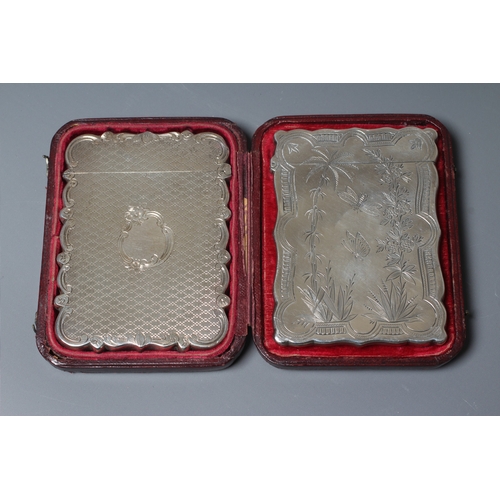 176 - A VICTORIAN SILVER VISITING CARD CASE by Cronin & Wheeler, Birmingham 1852, of shaped oblong form wi... 