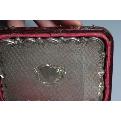 176 - A VICTORIAN SILVER VISITING CARD CASE by Cronin & Wheeler, Birmingham 1852, of shaped oblong form wi... 