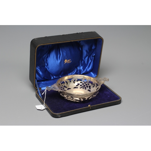 180 - AN EDWARD VII SILVER CIRCULAR BOWL by Martin, Hall & Co., Sheffield 1910, with two lug handles, with... 