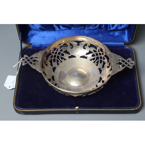 180 - AN EDWARD VII SILVER CIRCULAR BOWL by Martin, Hall & Co., Sheffield 1910, with two lug handles, with... 