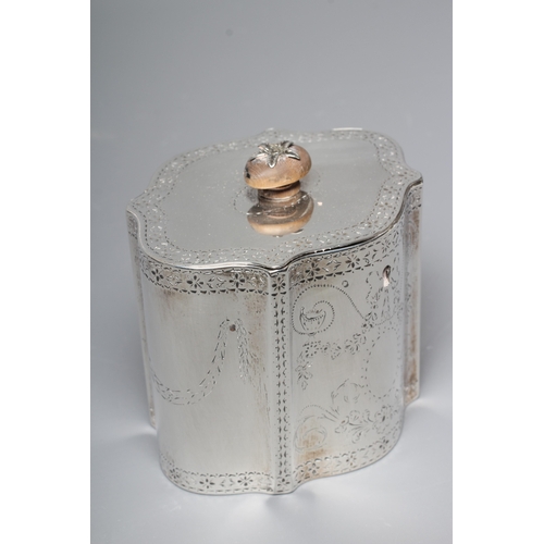 185 - A LATE GEORGE III SILVER TEA CADDY by Thomas Daniell, London 1780, of serpentine form, the flat hing... 