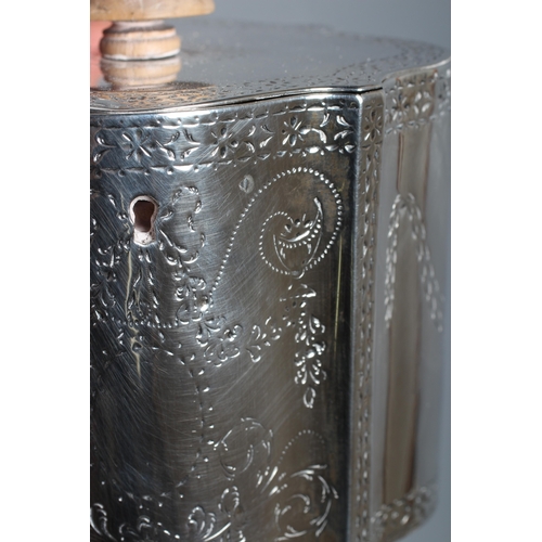 185 - A LATE GEORGE III SILVER TEA CADDY by Thomas Daniell, London 1780, of serpentine form, the flat hing... 