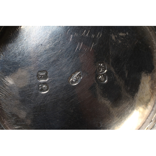 186 - A GEORGE IV SILVER MILK JUG by William M Traies, London 1825, the squat globular reeded body with ca... 