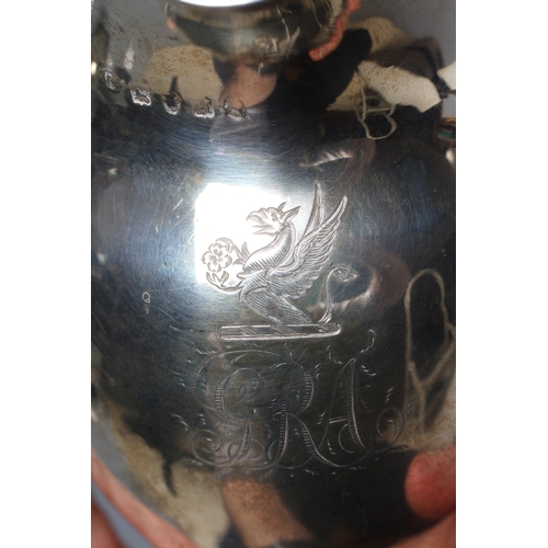 186 - A GEORGE IV SILVER MILK JUG by William M Traies, London 1825, the squat globular reeded body with ca... 