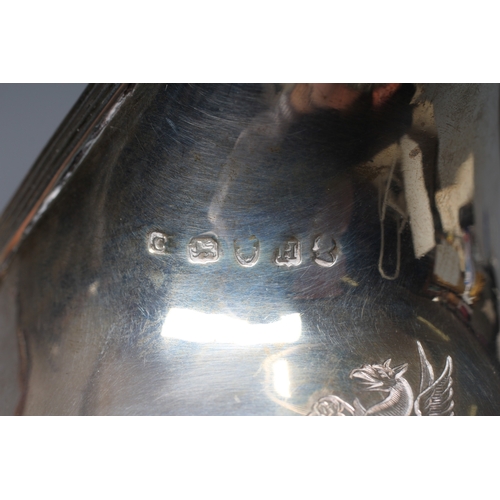 186 - A GEORGE IV SILVER MILK JUG by William M Traies, London 1825, the squat globular reeded body with ca... 