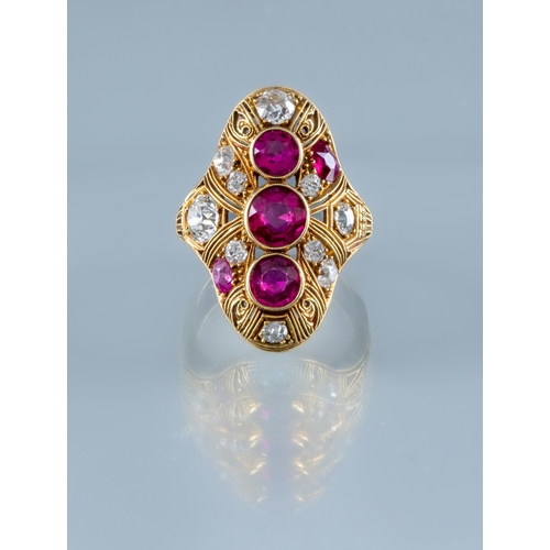 304 - A RUBY AND DIAMOND COCKTAIL RING, the domed oval panel centred by three facet cut rubies collet set ... 