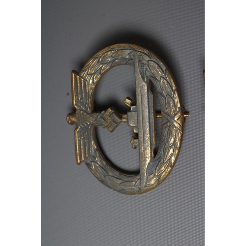 395 - TWO GERMAN THIRD REICH KRIEGSMARINE BADGES, comprising a U-Boat badge by Friedrich Orth, and a Mines... 