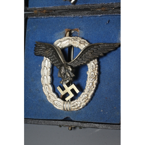 396 - TWO GERMAN THIRD REICH LUFTWAFFE BADGES, comprising a boxed Pilot Observer badge stamped GWL, and a ... 