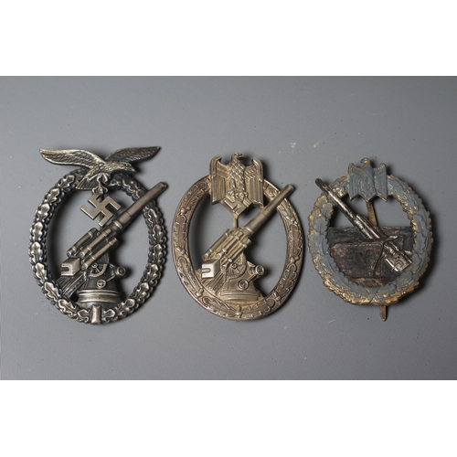 402 - THREE GERMAN THIRD REICH BADGES, comprising a Coastal Artillery badge with marks for Fec. Otto Placz... 