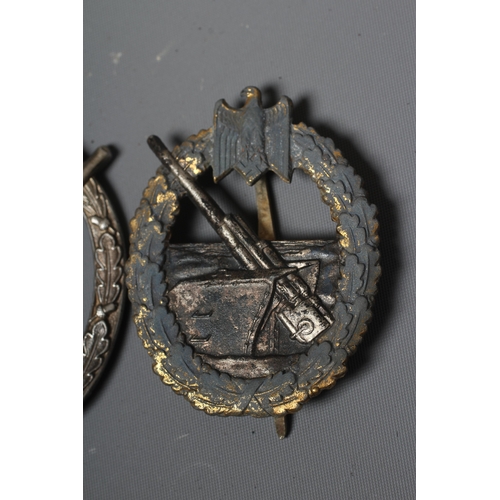 402 - THREE GERMAN THIRD REICH BADGES, comprising a Coastal Artillery badge with marks for Fec. Otto Placz... 