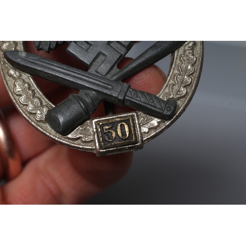 405 - A GERMAN THIRD REICH ASSAULT BADGE FOR 50 ENGAGEMENTS with JFS maker's marks, and vertical pin with ... 