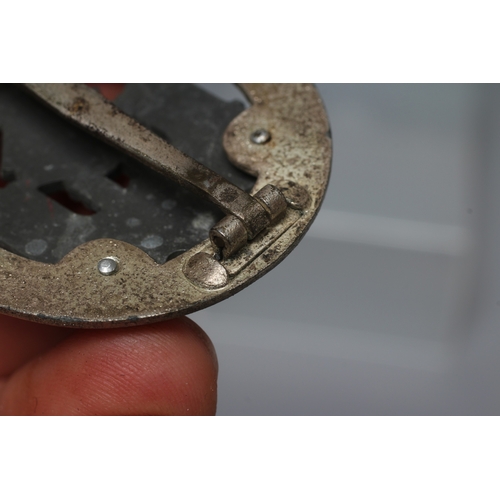 405 - A GERMAN THIRD REICH ASSAULT BADGE FOR 50 ENGAGEMENTS with JFS maker's marks, and vertical pin with ... 