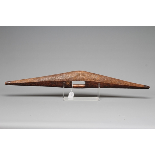 417 - AN ANTIQUE ABORIGINAL PARRYING SHIELD of carved asymmetrical diamond form, with chevron carved front... 