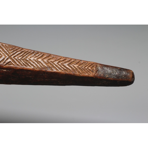 417 - AN ANTIQUE ABORIGINAL PARRYING SHIELD of carved asymmetrical diamond form, with chevron carved front... 