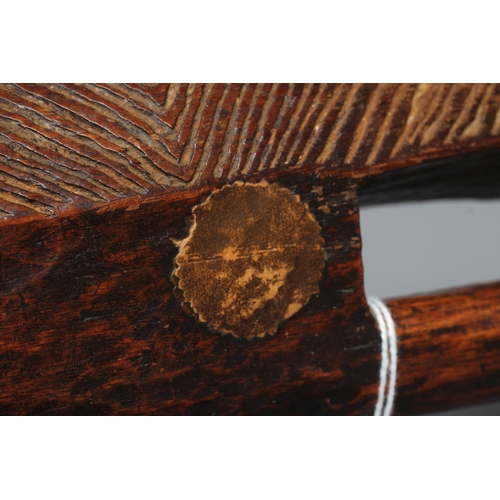 417 - AN ANTIQUE ABORIGINAL PARRYING SHIELD of carved asymmetrical diamond form, with chevron carved front... 
