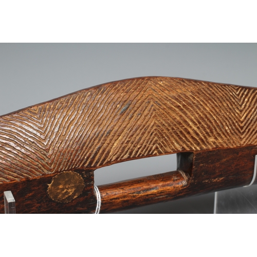 417 - AN ANTIQUE ABORIGINAL PARRYING SHIELD of carved asymmetrical diamond form, with chevron carved front... 
