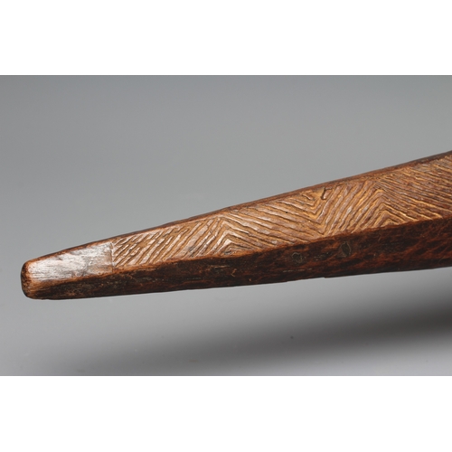 417 - AN ANTIQUE ABORIGINAL PARRYING SHIELD of carved asymmetrical diamond form, with chevron carved front... 