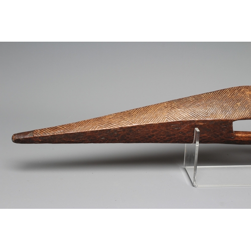 417 - AN ANTIQUE ABORIGINAL PARRYING SHIELD of carved asymmetrical diamond form, with chevron carved front... 