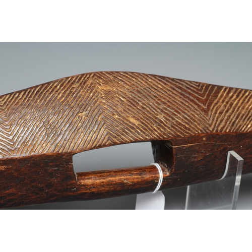 417 - AN ANTIQUE ABORIGINAL PARRYING SHIELD of carved asymmetrical diamond form, with chevron carved front... 