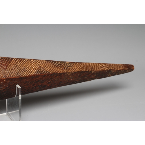 417 - AN ANTIQUE ABORIGINAL PARRYING SHIELD of carved asymmetrical diamond form, with chevron carved front... 