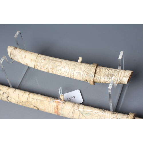 421 - TWO JAPANESE BONE MOUNTED SIDE ARMS, comprising a wakazashi with 15 1/2