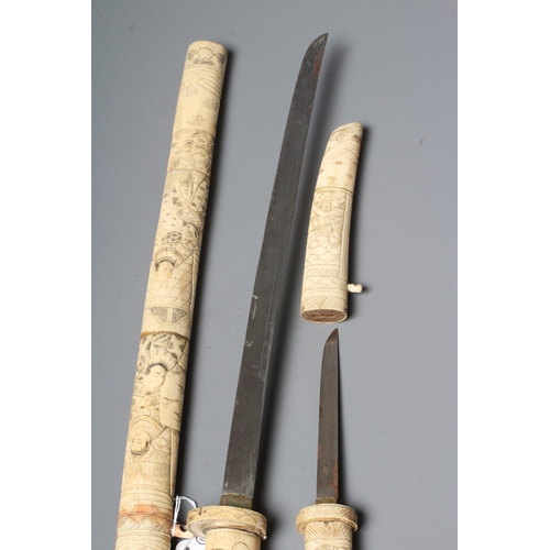 421 - TWO JAPANESE BONE MOUNTED SIDE ARMS, comprising a wakazashi with 15 1/2