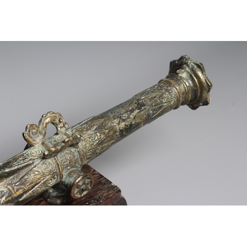 425 - A INDONESIAN BRONZE LANTAKA CANNON with flared muzzle, twin dolphin mounts, scroll rear sight, and f... 