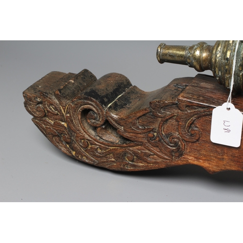 425 - A INDONESIAN BRONZE LANTAKA CANNON with flared muzzle, twin dolphin mounts, scroll rear sight, and f... 