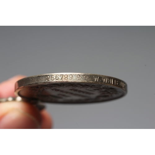 432 - A MERITORIOUS SERVICE MEDAL awarded to Pte. W. Whitehurst of the Labour Corps., on typical ribbon