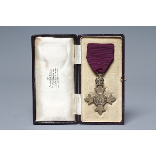 438 - A SILVER OBE, London 1919, Garrard & Co. Ltd, with purple ribbon, cased