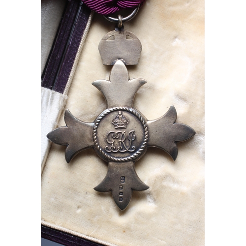 438 - A SILVER OBE, London 1919, Garrard & Co. Ltd, with purple ribbon, cased
