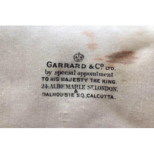 438 - A SILVER OBE, London 1919, Garrard & Co. Ltd, with purple ribbon, cased