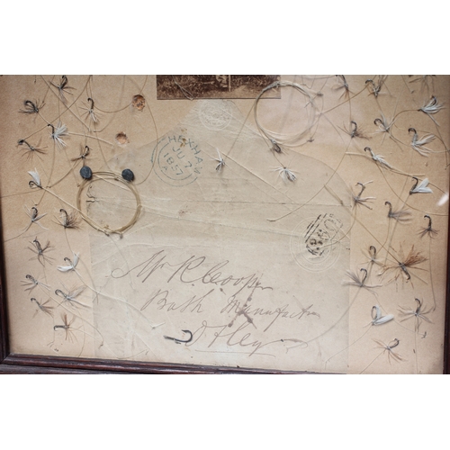 452 - A VICTORIAN FRAMED FISHING DISPLAY centred by a photograph of a gentleman in tails, top hat and fish... 