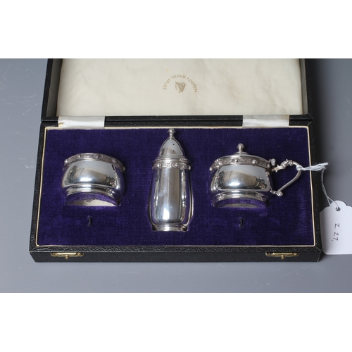 98 - A MODERN IRISH SILVER THREE PIECE CRUET by Irish Silver Ltd., Dublin 1979, of bombe form with cast a... 