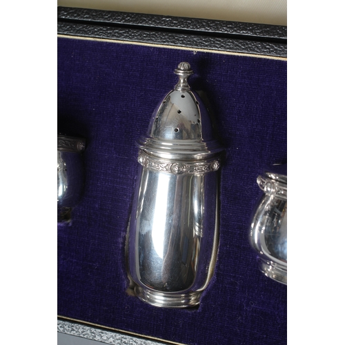 98 - A MODERN IRISH SILVER THREE PIECE CRUET by Irish Silver Ltd., Dublin 1979, of bombe form with cast a... 
