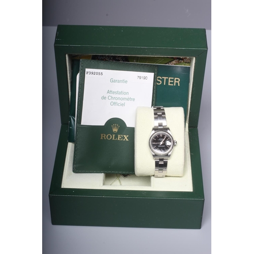 199 - A LADYS' ROLEX OYSTER PERPETUAL DATE CHRONOMETER WRISTWATCH, the black dial with applied batons, cen... 
